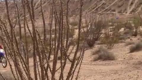Desert bmx ride falls down hill