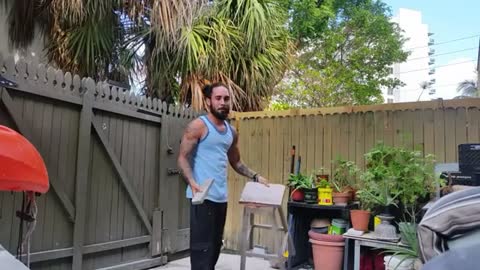 Guy tries to balance on a small stool and it snaps