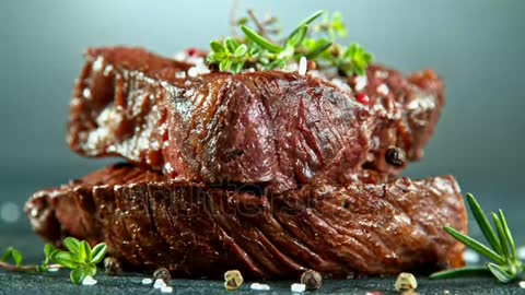 Close-up of falling tasty beef steak