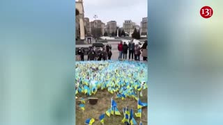 Residents commemorate those who died in the war in Kyiv’s Freedom Square