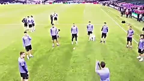 Real Madrid players warm up on the pitch