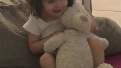 Loving her teddy