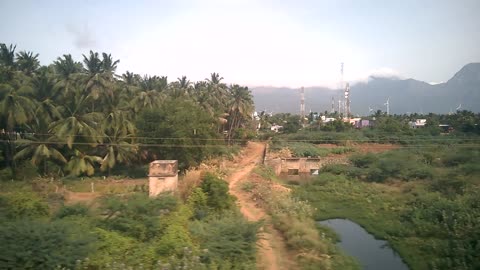 Scenic Beauty of Village from inside of a moving train