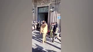 Army vehicle smashes through Bolivian palace doors