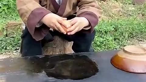 A small child cooking