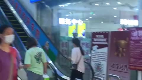 People coming and going in underground mall