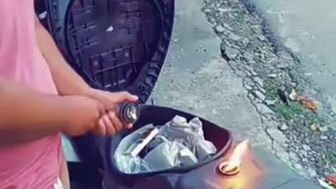 Lighting a cigarette through the Motorcycle Tank