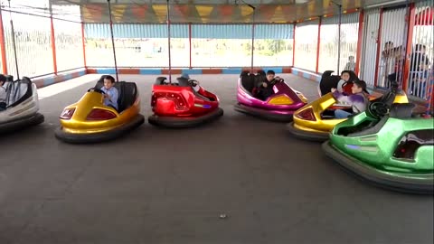 Kids are crazy drivers of small cars in the kids fun land