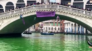 Climate change protesters turn Venice canal green