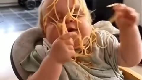 Baby Trying To Eat Noodles In One Bite