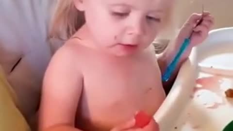 funny baby eating lemon