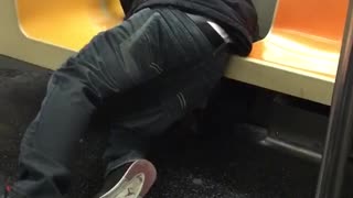 Man asleep on subway falls in crack between seats