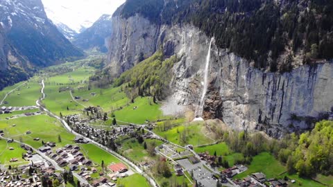 Aerial Footage Of A Village Built In A Valley Between Mountains