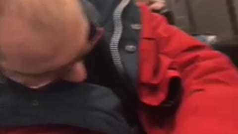 Guy black jacket grey pants yelling and singing red jacket guy sleeping