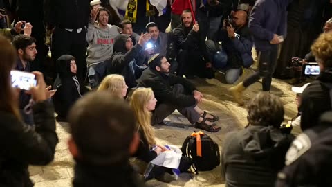 Jewish nationalists march in Jerusalem’s Old City on the eve of Hanukkah