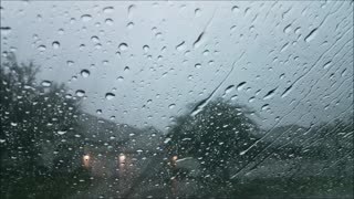 "30 mins: Serene car window rain, gentle thunder, and heavy drops—a peaceful sleep aid."