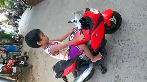 Baby girl riding BMW K 1300 bike