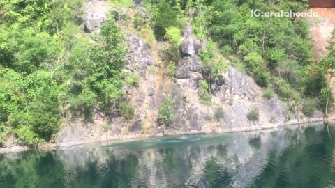 Guy jumps off cliff and belly flops into lake, gets bloody nose