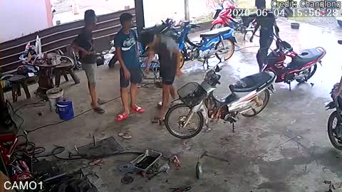 Moped Crashes into Garage