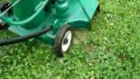 lawnmorrow cutting lawn with only gasoline vapor and water injection,