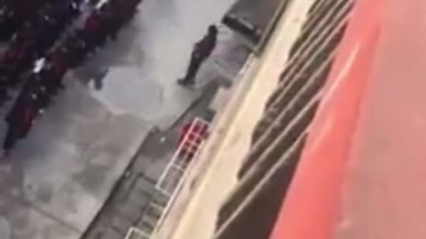 Uyghur concentration camp in Xinjiang shows CCP guards beating detainees with a strap