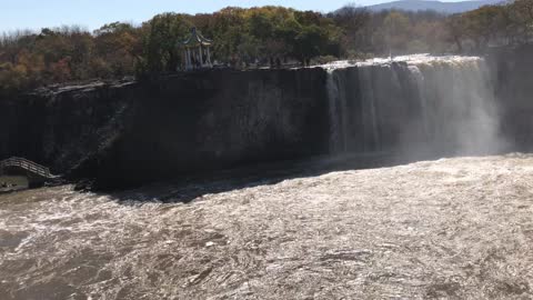 The waterfall on the mountain is very beautiful