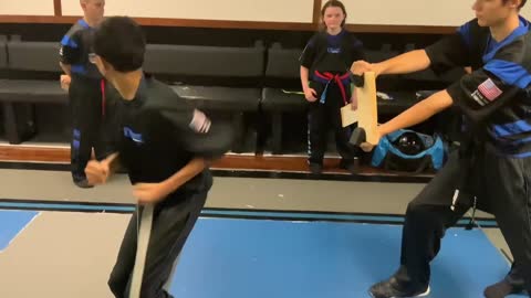 Jump spin side kick board break