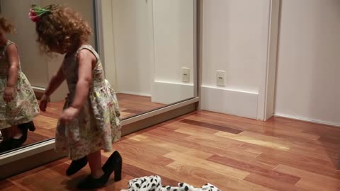 Little cute girl dance front the mirror