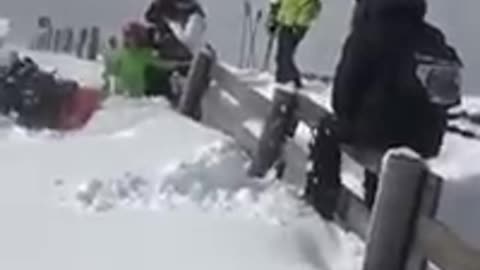 Orange snowsuit fence hop fail