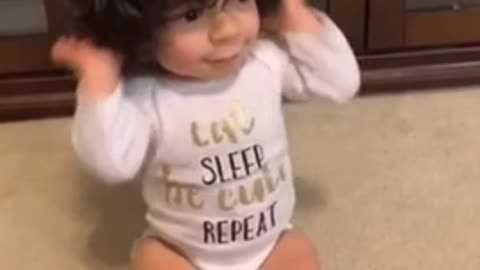 Baby amazingly learns where his body parts are located