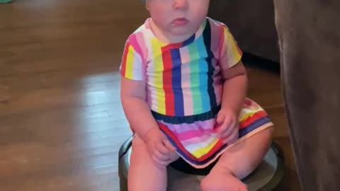 Baby rides on Roomba