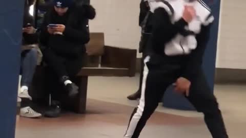 Guy dances and front flips to "bring me to life" song in subway station