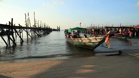 Boats on the shore of a beach in Indonesia