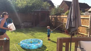 Toddler gets hold of the cold water hose with hilarious results