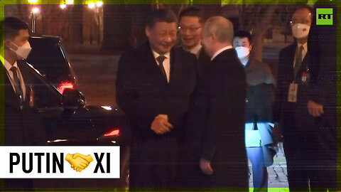 Putin escorts Xi to his car following the talks