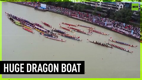 Over 2,000 men transport world's longest '100-meter dragon boat'