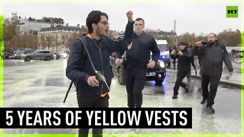 Activists spray yellow paint on Champs-Elysees, marking five years of Yellow Vests