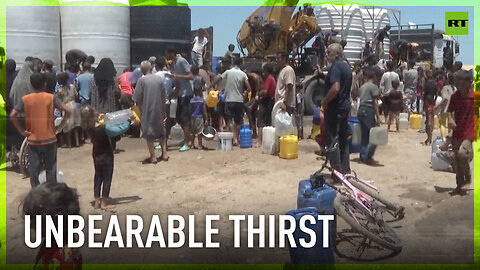 Palestinians gather around water tanks to collect drinking water amid shortages