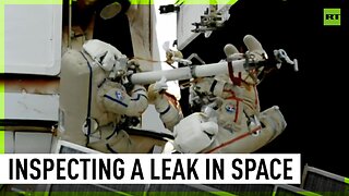 Russian cosmonauts inspect coolant leak spot outside ISS