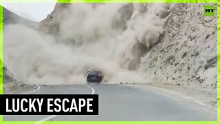 Driver engulfed in rock avalanche, escapes unharmed