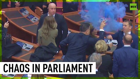 Chairs piled up & blue smoke in Albanian parliament as MPs vote to lift ex-PM's immunity