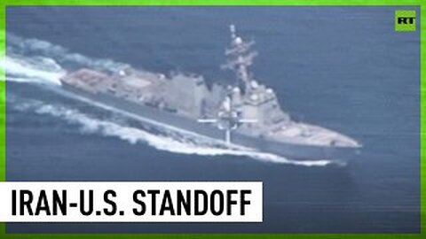 Iran threatens to open fire on US warship