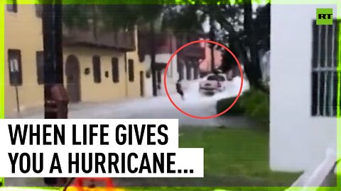 Florida man WAKEBOARDS in flooded street after hurricane Ian