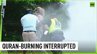 Woman with fire extinguisher interrupts Quran burning in Stockholm