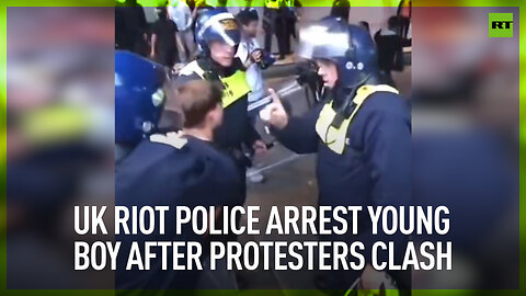 UK riot police arrest young boy after protesters clash