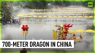 Giant ‘golden dragon’ made of rafts floats down river in China