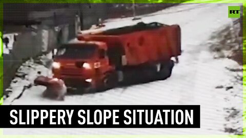 Trucks drift down the road attempting to clear snow