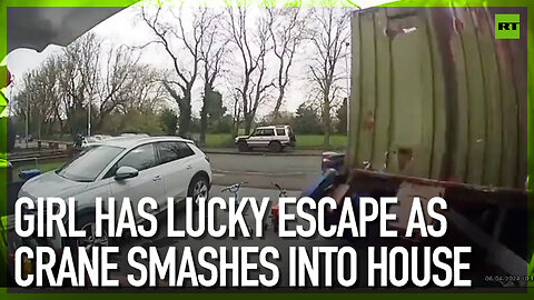 Girl has lucky escape as crane smashes into house