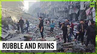 Gazans search through debris after strike on Jabalia refugee camp