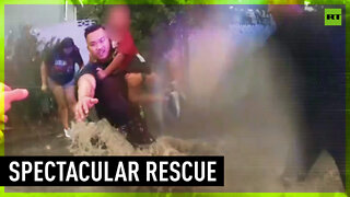 Officers brave flash flood to rescue family